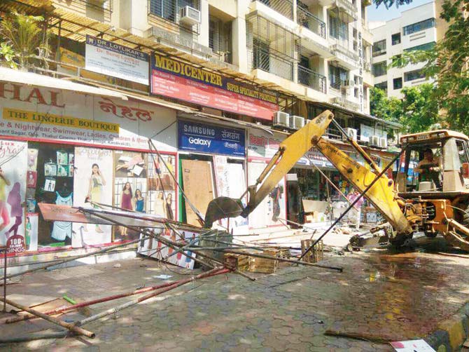 Illegal hawkers cleared from the area during the demolition drive in Thakur village yesterday