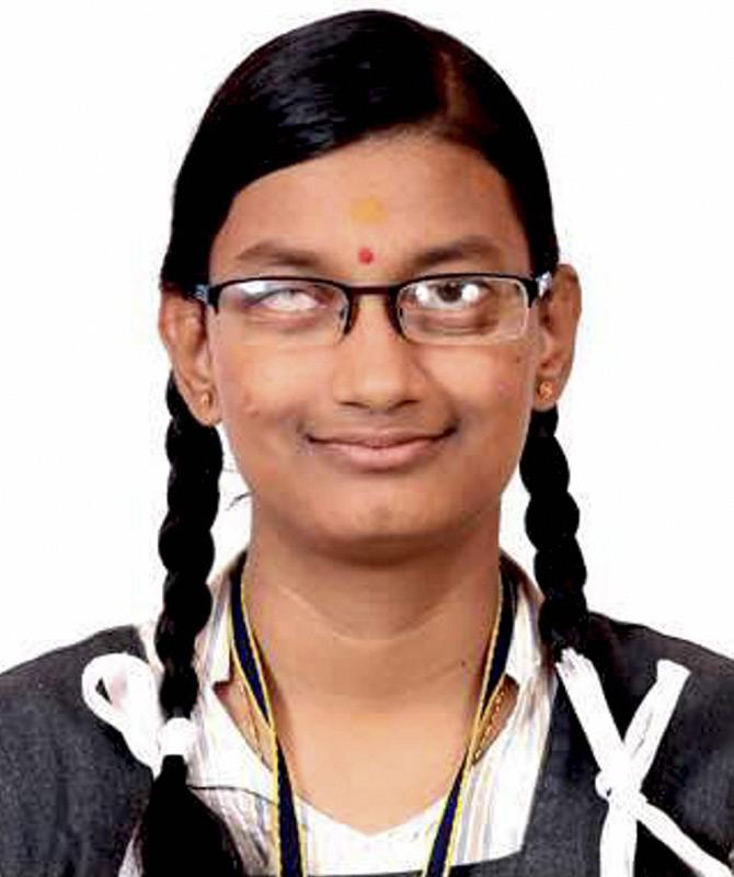Dharshana MV scored third highest marks in CBSE class XII exams in differently-abled category. Hailing from Krishnagiri in Tamil Nadu, Dharshan, who has almost nil vision in right eye and partial in left, uses magnifying glass to read. Pic/PTI