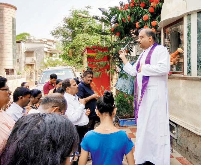Fr. Marshal Lopes speaks to parishioners at the shrine