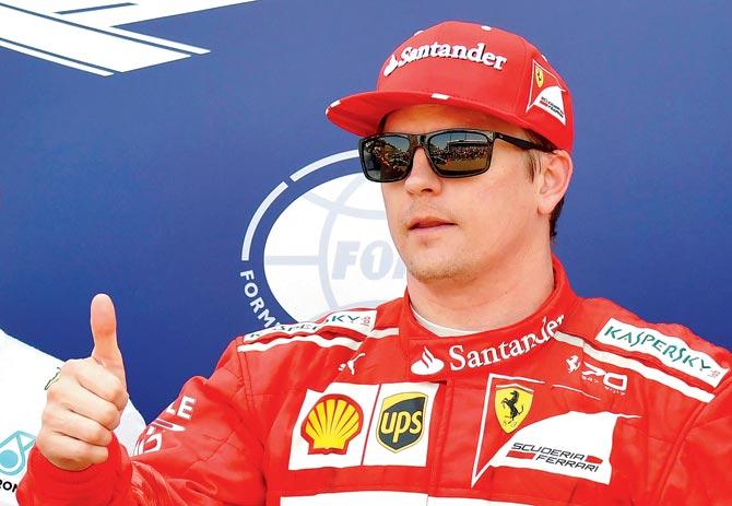 Ferrari’s driver Kimi Raikkonen celebrates after claiming pole position in Monaco on Saturday. Pic/AFP