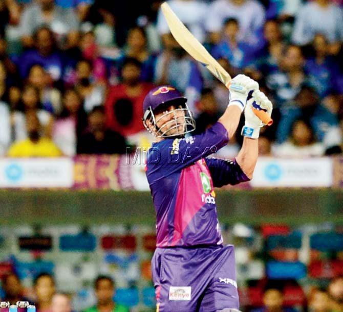 Rising Pune Supergiant’s Mahendra Singh Dhoni hoists one into the stands en route his 26-ball 40