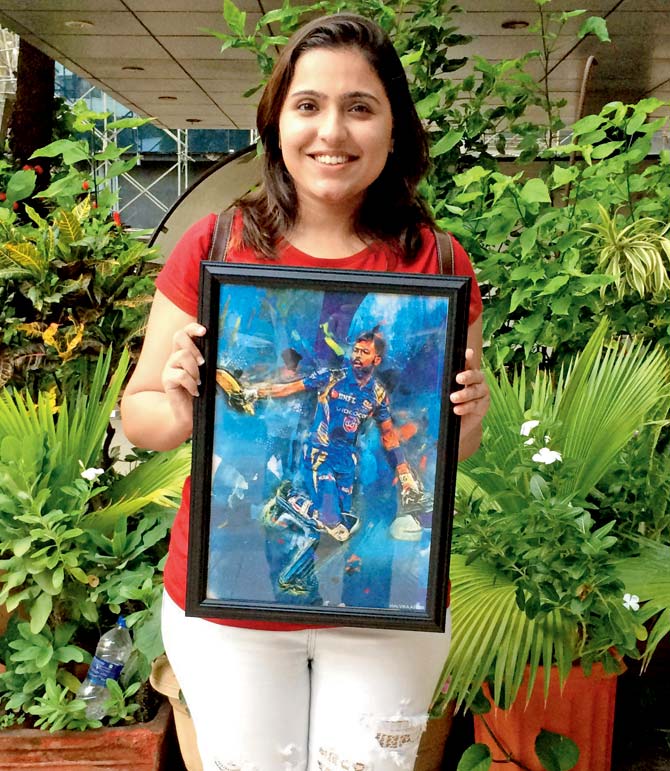 Malvika Asher poses with her painting of Hardik Pandya