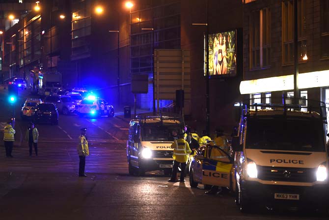 Police deploy at scene of a reported explosion during a concert in Manchester, England. Pic/AFP
