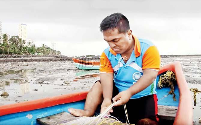 Dharmai tries his hand at fishing in a still from the campaign video