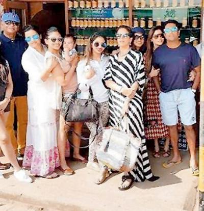 Shobhaa and Dilip De with their children in Coorg. Kanika Kapoor is standing behind Aditya Kilachand (in shorts).