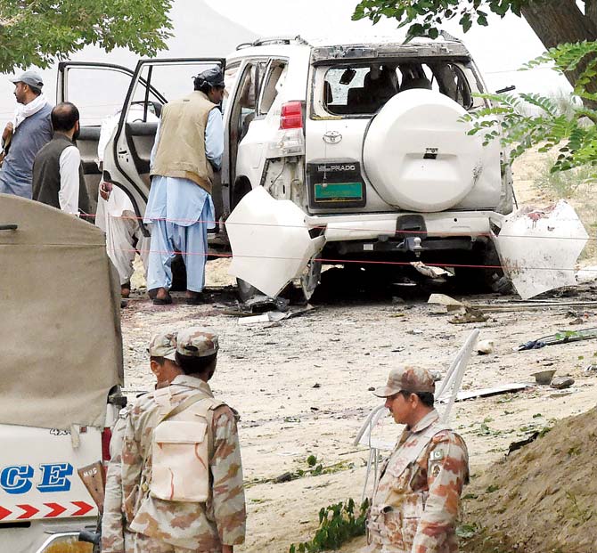 Pakistani security officials examine the site of the powerful explosion in Mastung district. Pic/AFP