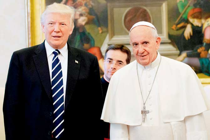 Pope Francis (right) stands with US President Donald Trump during a private audience at the Vatican. Pic/AFP