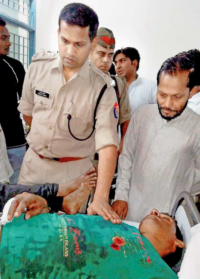 One of those injured in the violence yesterday. Pic/PTI