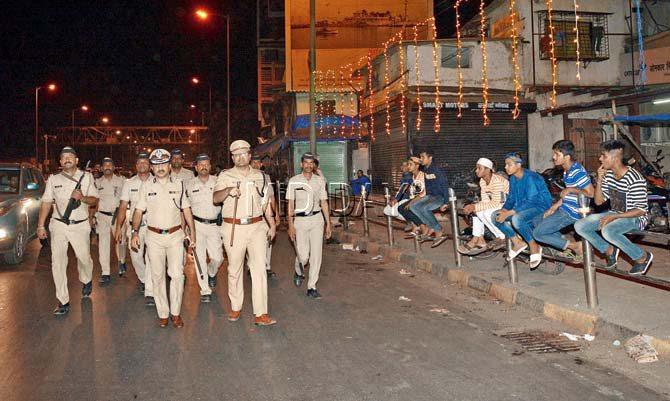 Cops and community members both march on the roads to ensure there was no disturbance on the holy night. Pics/Satej Shinde