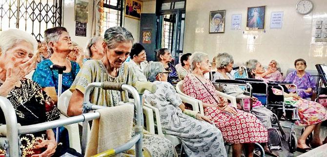 Elderly at St Anthonys Home For The Aged listen to the musicians in rapt attention