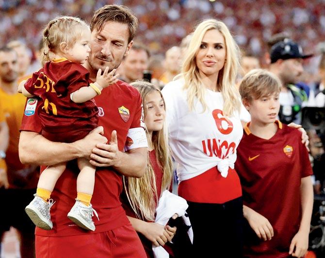 Italian club AS Roma’s retiring legend Francesco Totti was joined by his daughters, Isabel and Chanel, son Cristian and wife Ilary after his farewell match against Genoa at the Olympic stadium in Rome on Sunday. Pic/AFP