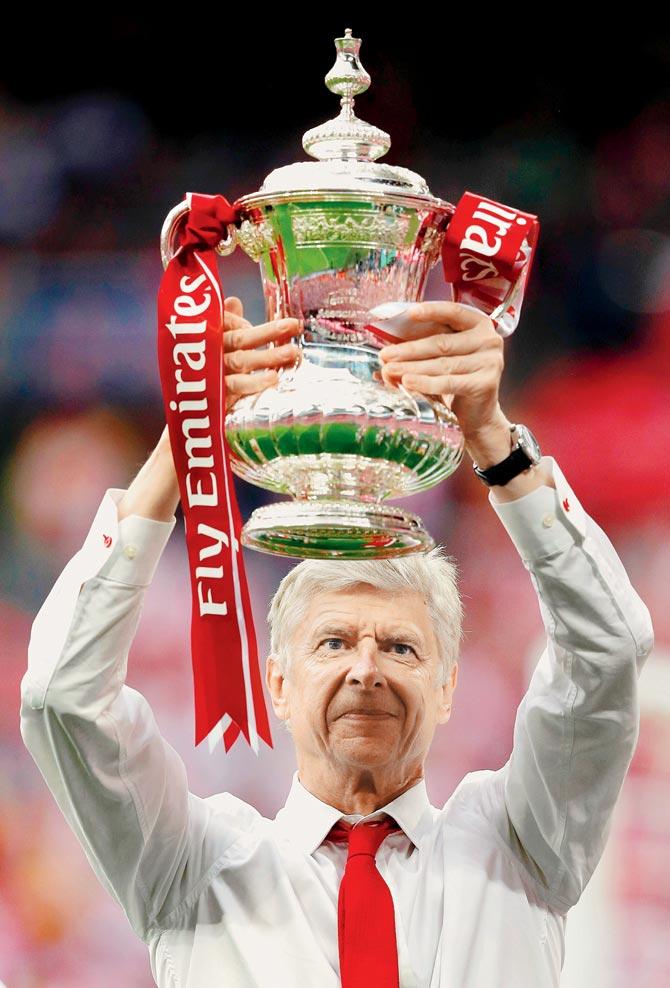 Arsenal manager Arsene  Wenger holds the FA Cup 