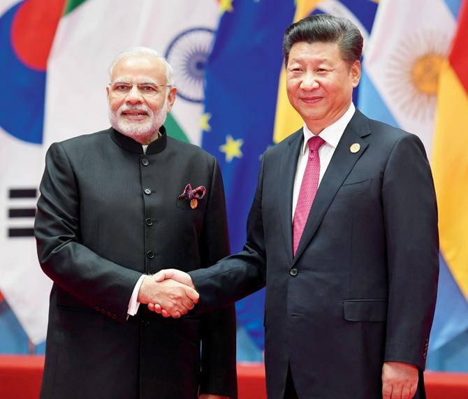 PM Modi with Chinese President Xi Jinping (R) during the G20 summit, last year. Pic/AFP