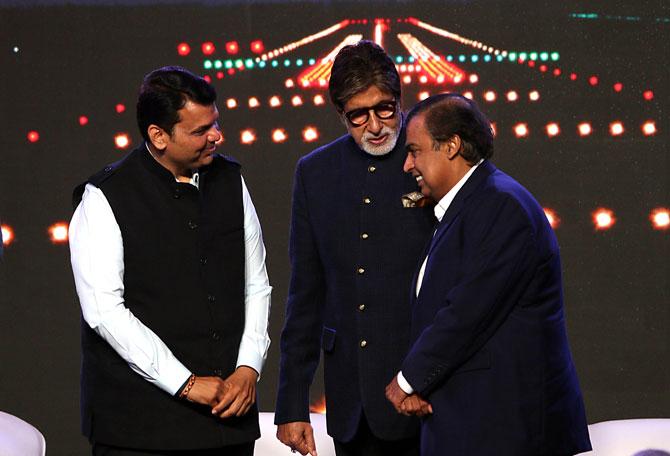 Photos: Mukesh Ambani shares a light moment with Amitabh Bachchan