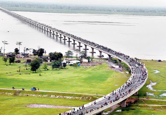 Prime Minister Narendra Modi (also inset) at the Dhola-Sadia bridge, the country’s longest river bridge, which he inaugurated in Assam yesterday. The three-lane, 9.15 km long bridge has been built over river Lohit, a tributary of river Brahmaputra. It was named after Bhupen Hazarika. Pic/PTI