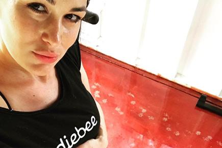 Brie Bella shows off post-pregnancy belly, ready to get her curves back