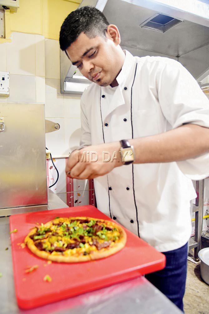 Julius Dabre prepares the Roasted Vegetable Pizza. PICS/ SAMEER MARKANDE