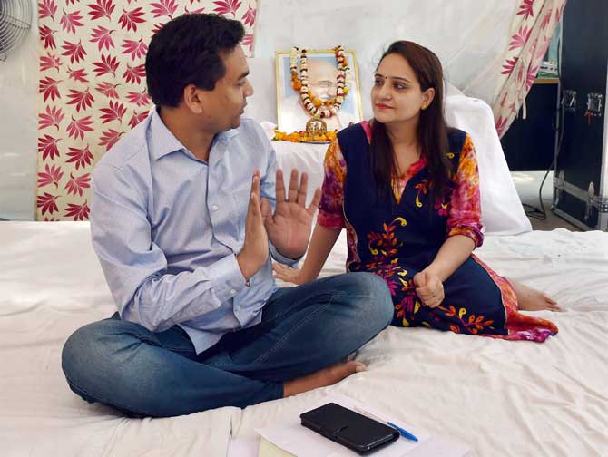 Sacked Delhi minister Kapil Mishra sharing a word with his wife during an indefinite hunger strike at his residence in New Delhi on Wednesday against the alleged misuse of public money to send Delhi Chief Minister Arvind Kejriwal’s close aides on a foreign trip.