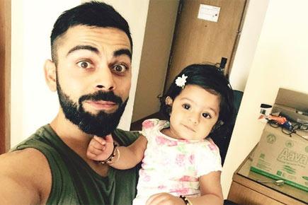 Forget MI vs RCB... this pic of Kohli with Bhajji's daughter Hinaya is too cute!