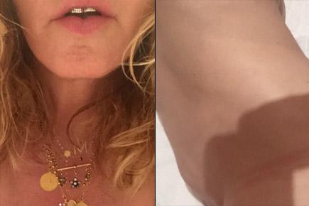 58-year-old singer Madonna strips and poses completely naked