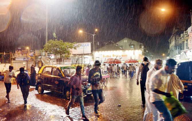Mumbai receives rain in the month of May; outside Kurla station, Mumbai on Friday evening. PIC/SNEHA KHARABE