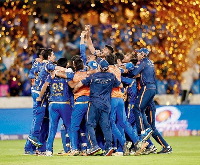 Mumbai Indians players are ecstatic after winning the IPL-10 title. Pic/PTI
