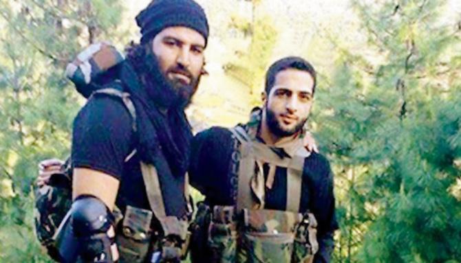 File photo of Sabzar Bhat with Burhan Wani (R). Pic/Twitter
