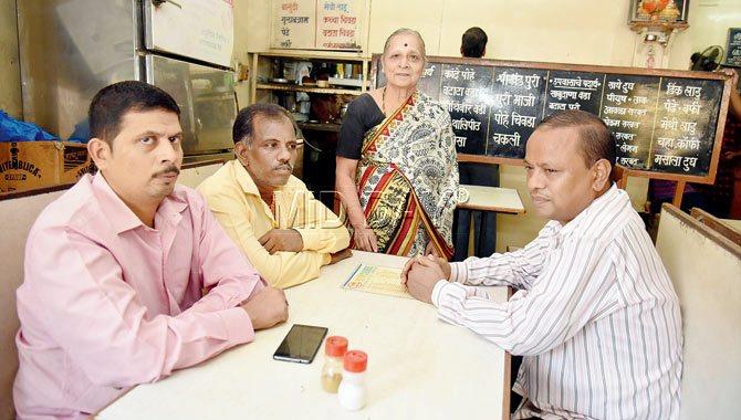 Hemamalini Tambe with the staffers, (from left) Mangesh, Chandrakant and Ankush, who have been working in the premises for over two decades. Pic/Shadab Khan