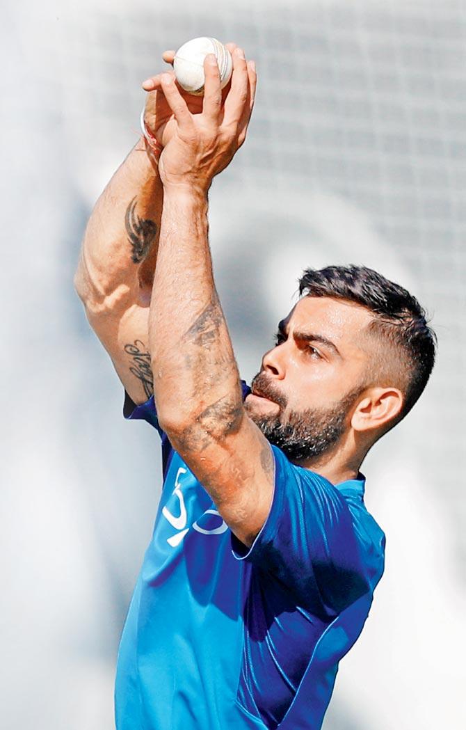 India skipper Virat Kohli takes a catch during a practice session at Lord’s Cricket Ground in London on Friday. Pic/AFP