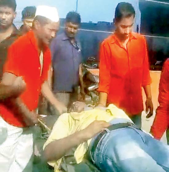 A grab from the video made by Ajay Bose, of Abdul Ansari being taken to a private ambulance