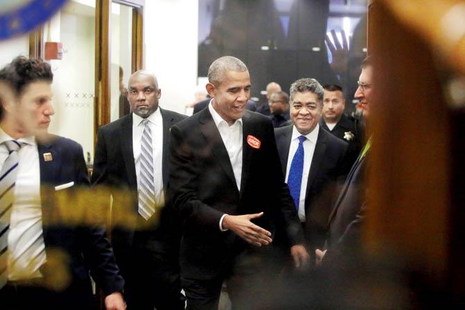 Former President Barack Obama extends his hand as he attends Cook County jury duty at the Daley Center on Thursday. PIC/AFP