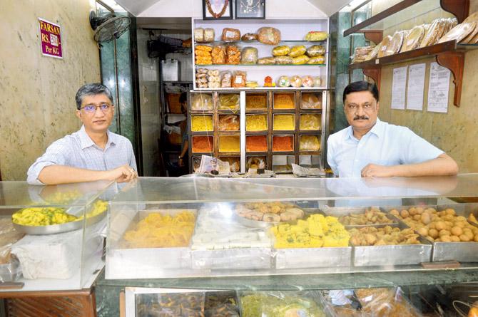 Sunil and Rakesh Shah at the farsan shop their father introduced Borivli to in 1953. PICS/FALGUNI AGRWAL; (Inset) An archival image of Mukundrai Shah at the old Bhavnagri Farsan House