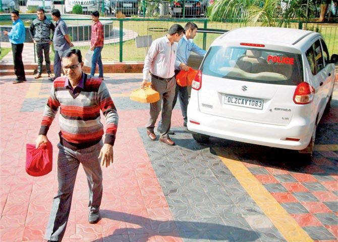 CBI officials arrive at a district court to file the chargesheet in connection with the 2012 PMT, in Bhopal last Thursday. PIC/PTI