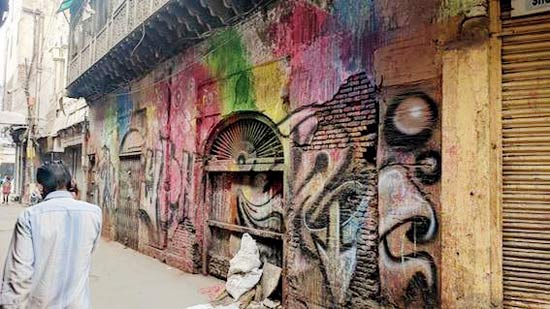A defaced wall of an old building in Churiwalan in old Delhi