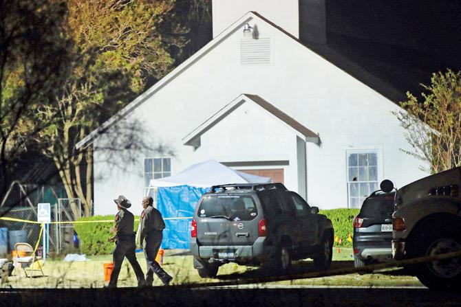 Law enforcement officials continue their investigation at Sutherland Springs Baptist Church