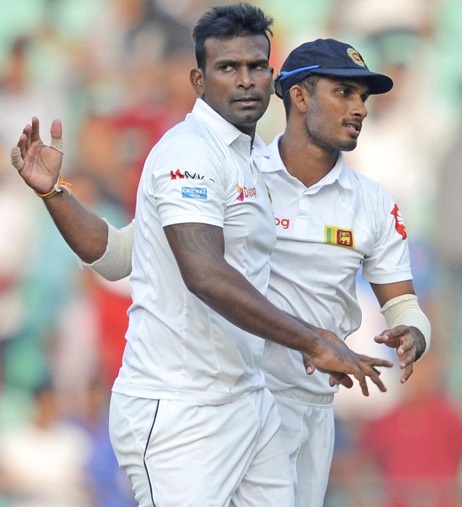 Sri Lankan bowler Gahiru Gamage celebrates the wicket of Indian batsman K.L. Rahul during the 2nd cricket test match in Nagpur on Friday. Pic/PTI