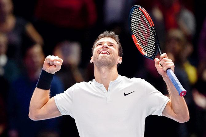Bulgaria’s Grigor Dimitrov is ecstatic after beating Austria’s Dominic Thiem in a World Tour Finals match in London yesterday. pic/AFP