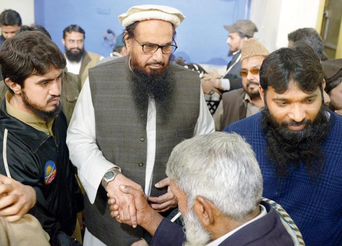 JuD chief Hafiz Saeed meets his supporters in Lahore. pic/AFP