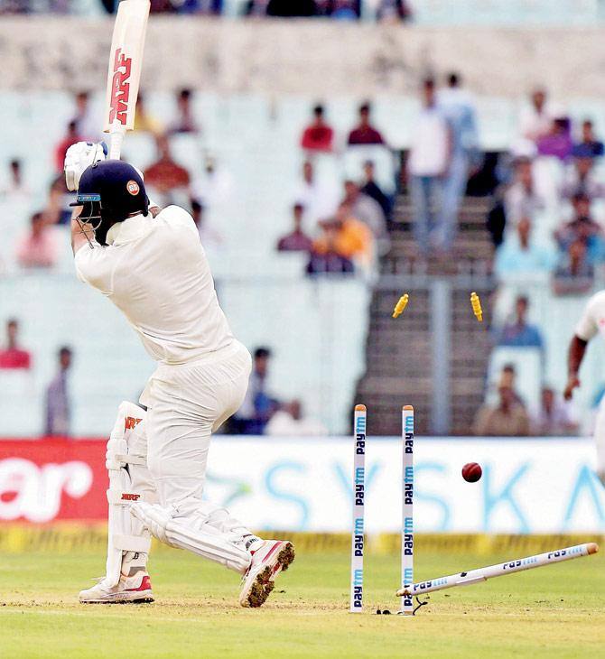 India opener Shikhar Dhawan is bowled out by Sri Lankan pacer Suranga Lakmal for eight on the opening day of the first Test at Eden Gardens in Kolkata yesterday. PICS/PTI 