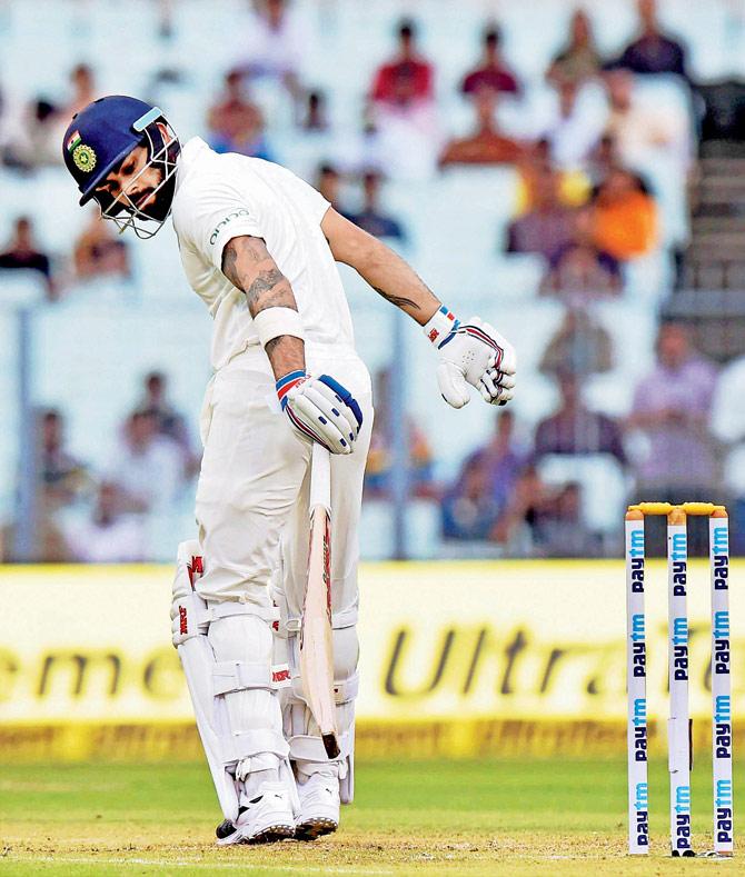 Virat Kohli reacts after being trapped leg before wicket by Lakmal for 0 