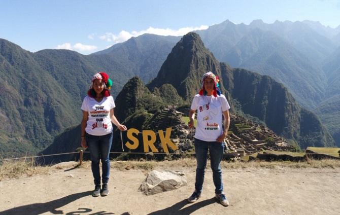 Claudia and Manigret holding an SRK banner