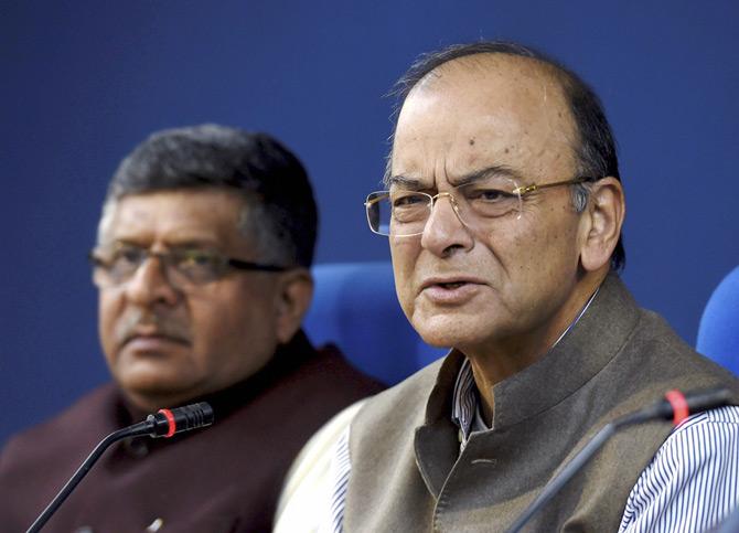 Union Minister for Finance and Corporate Affairs, Arun Jaitley addresses the media after a cabinet meeting, in New Delhi on Wednesday. Union Law & Justice Minister Ravi Shankar Prasad is also seen. Pic/PTI