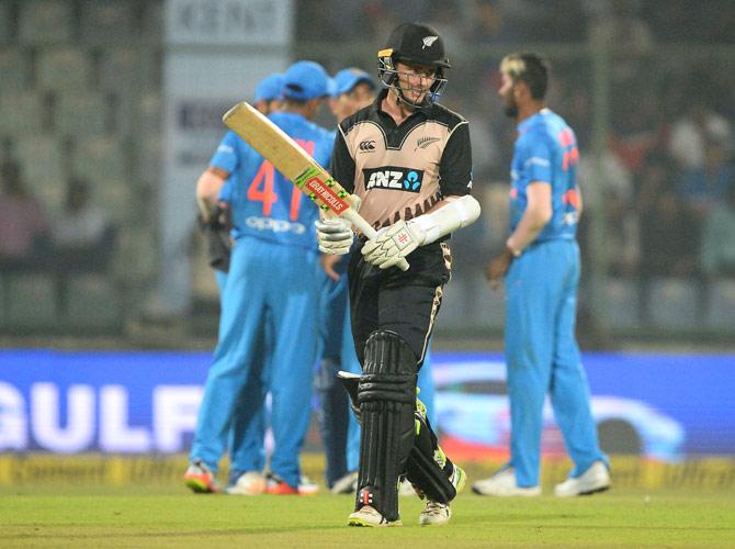 New Zealand batsman and team captain Kane Williamson (L) walks back towards pavillion after he was dismissed during the first T20 cricket match between New Zealand and India at Feroz Shah Kotla Cricket Stadium in New Delhi on November 1, 2017. Pic/AFP