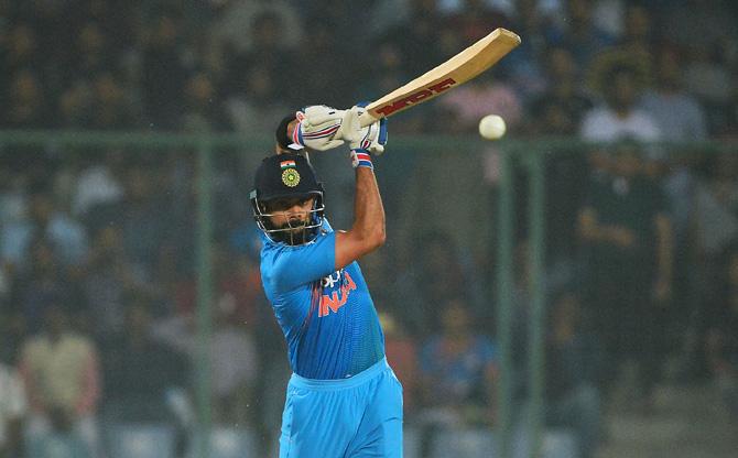 Indian batsman and team captain Virat Kohli plays a shot during the first T20 cricket match between New Zealand and India at Feroz Shah Kotla Cricket Stadium in New Delhi on November 1, 2017. Pic/AFP