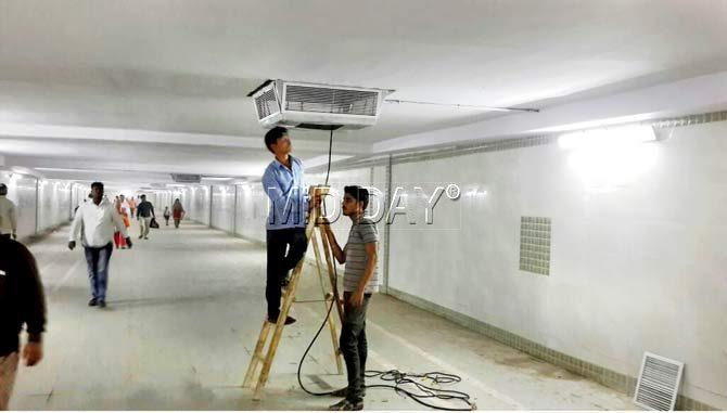 BMC workers were seen fixing an exhaust fan at Kurla subway on Wednesday morning