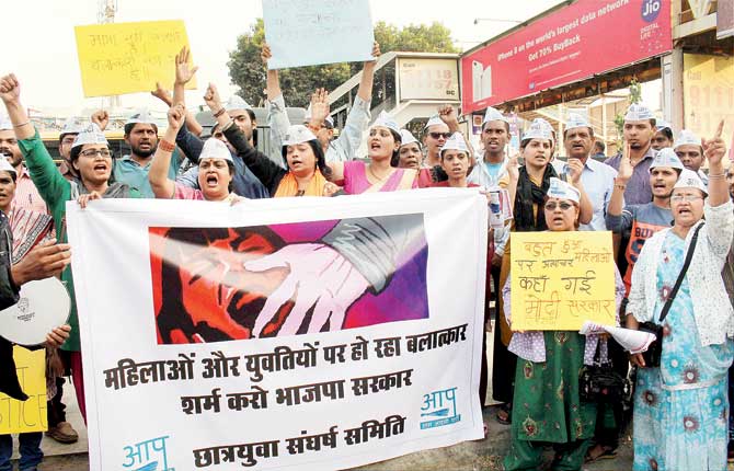Aam Aadmi Party Mahila Shakti activists stage a protest against the rape in Bhopal. Pic/PTI