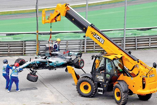 Mercedes driver Lewis Hamilton’s damaged car is towed away from the racetrack after he crashed it during qualifying for the Brazilian GP at the Interlagos Circuit in Sao Paulo on Saturday. pic/AFP