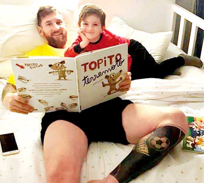 Lionel Messi with sons Thiago