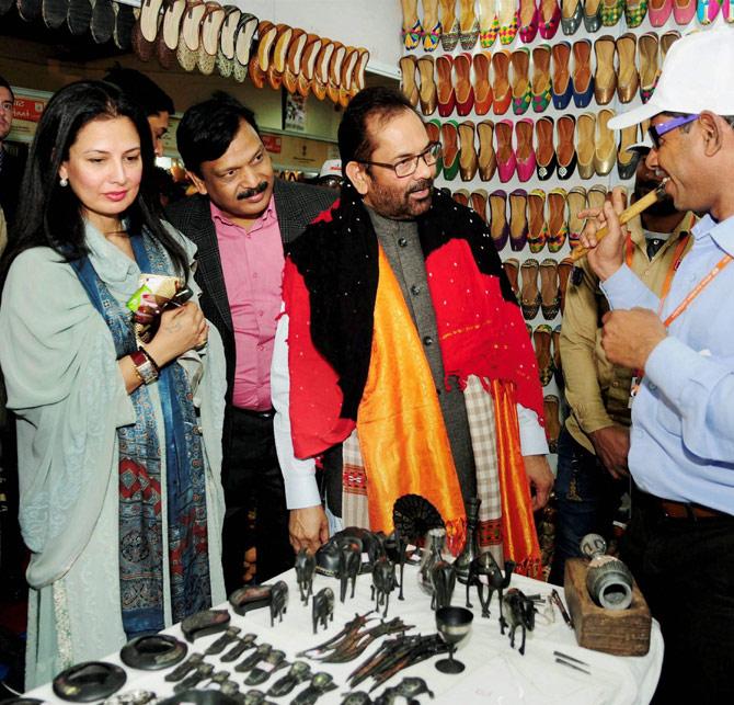 Union Minister for Minority Affairs, Mukhtar Abbas Naqvi visiting stalls after inaugurating the Hunar Haat, at the 37th India International Trade Fair (IITF) at Pragati Maidan in New Delhi on Wednesday. Minister of State for Women & Child Development and Minority Affairs, Virendra Kumar is also seen. Pic/PTI