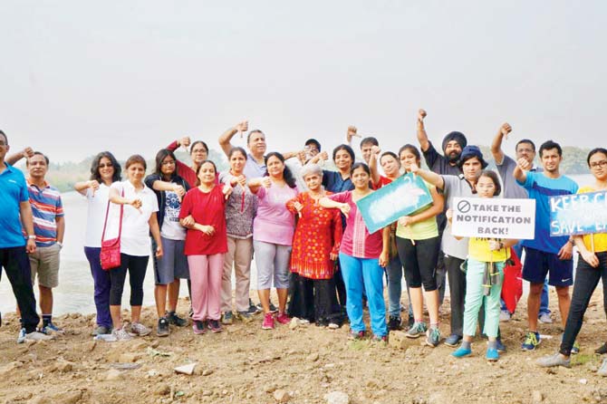 Residents have joined hands to protest against the illegal construction work being carried out in the wetland area